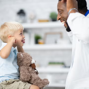 dad telling funny jokes to his son